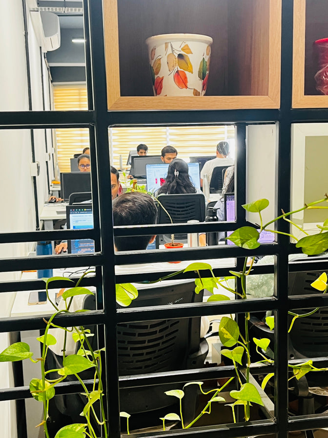 Creative office interior and software development environment featuring the Ambiw team at work.