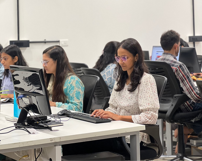 Focused team members designing and developing e-commerce solutions at their office desks.