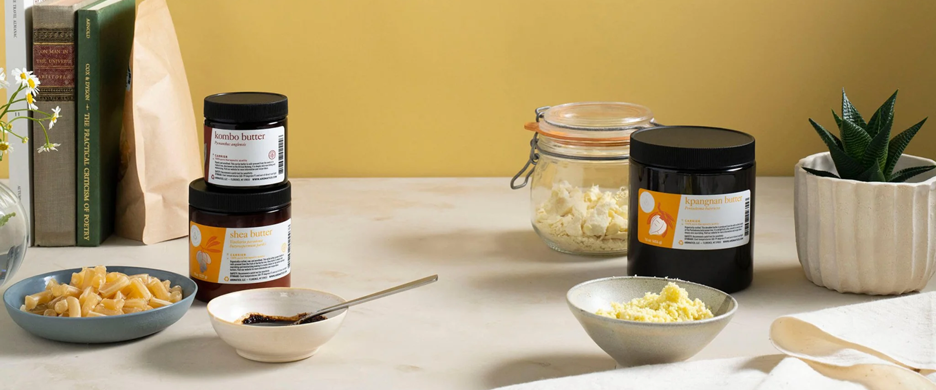 A warm, earthy product layout featuring Aeromatics International’s natural skincare ingredients