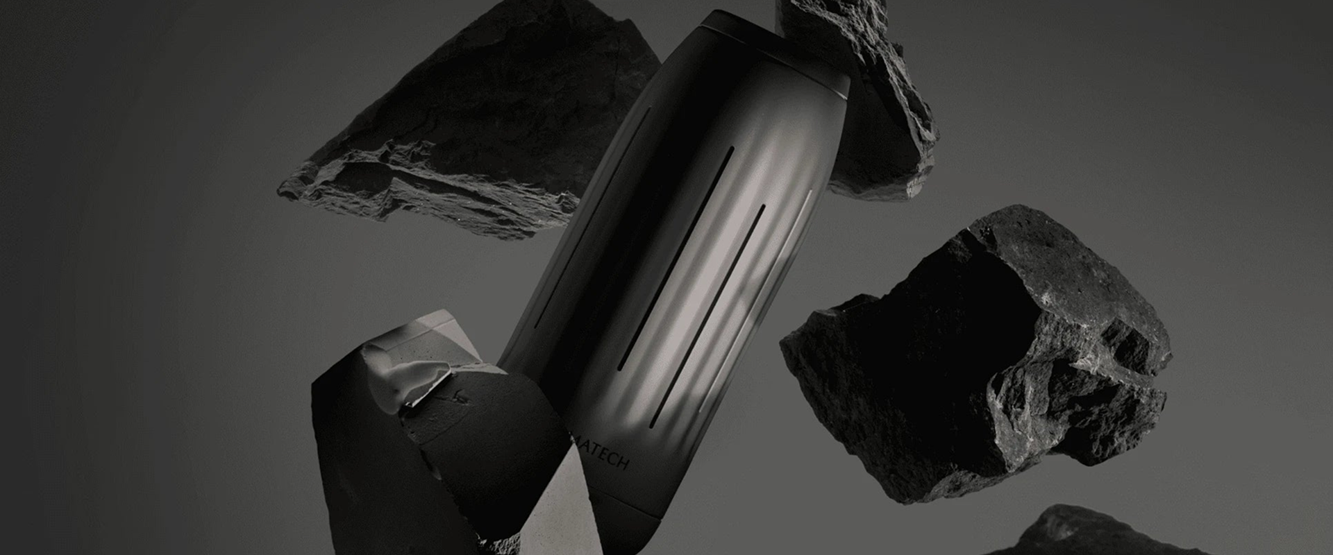 A dark desktop hero banner for Aromatech featuring a sleek scent diffuser surrounded by floating rocks.