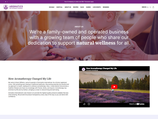 Aromatics International "About Us" desktop page featuring a family-focused hero banner above a video section titled "How Aromatherapy Changed My Life."