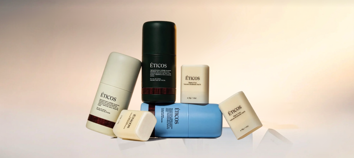 A cluster of ETICOS natural deodorant sticks and refills in various colors, featured on their Shopify store designed and optimized by Ambiw